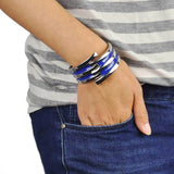 Man wearing a blue bracelet with silver ring - Striped Metal Hinged Bangle Vintage-Inspired Bracelet