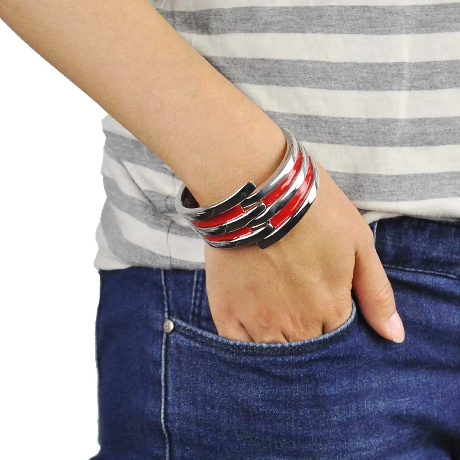 Man wearing a red and black striped metal hinged bangle bracelet