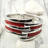 Vintage-inspired red and silver heart ring on striped metal hinged bangle