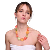 Woman wearing a Summer Chunky Bead Necklace made of fruit.