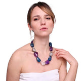 Woman wearing chunky bead necklace with blue and white beads