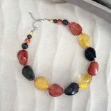Chunky bead necklace with glass beads and metal chain, perfect for summer style.