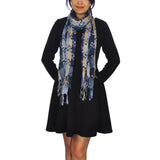 Woman wearing super soft woven check scarf.
