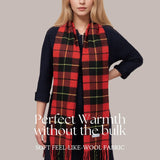 Tartan winter scarf in red, green, and black over navy sweater for men and women