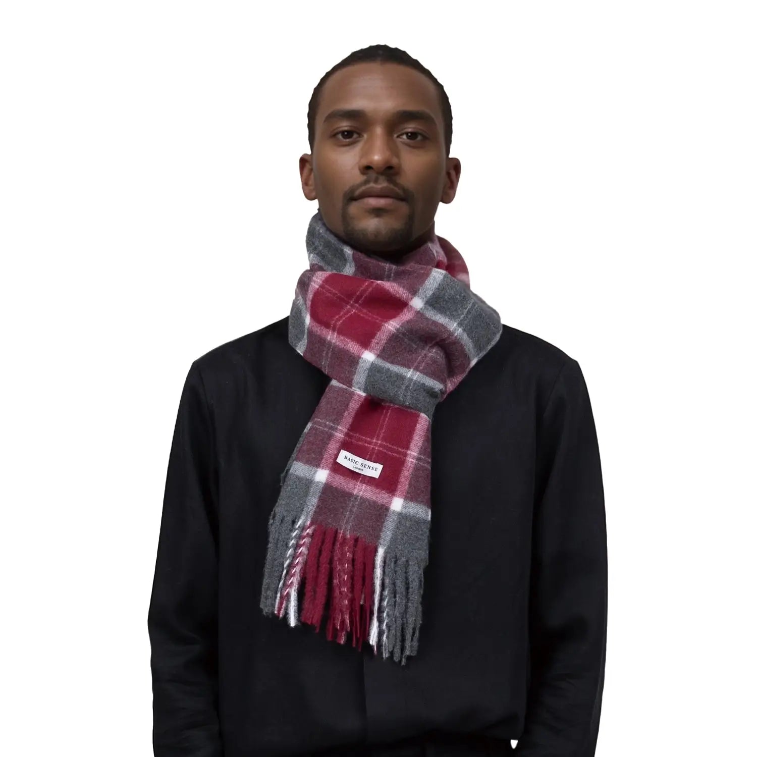 Plaid Tartan Winter Scarf in red, gray, and white worn around a person’s neck