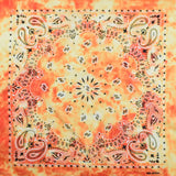 Tie dye paisley bandana in red and yellow design.