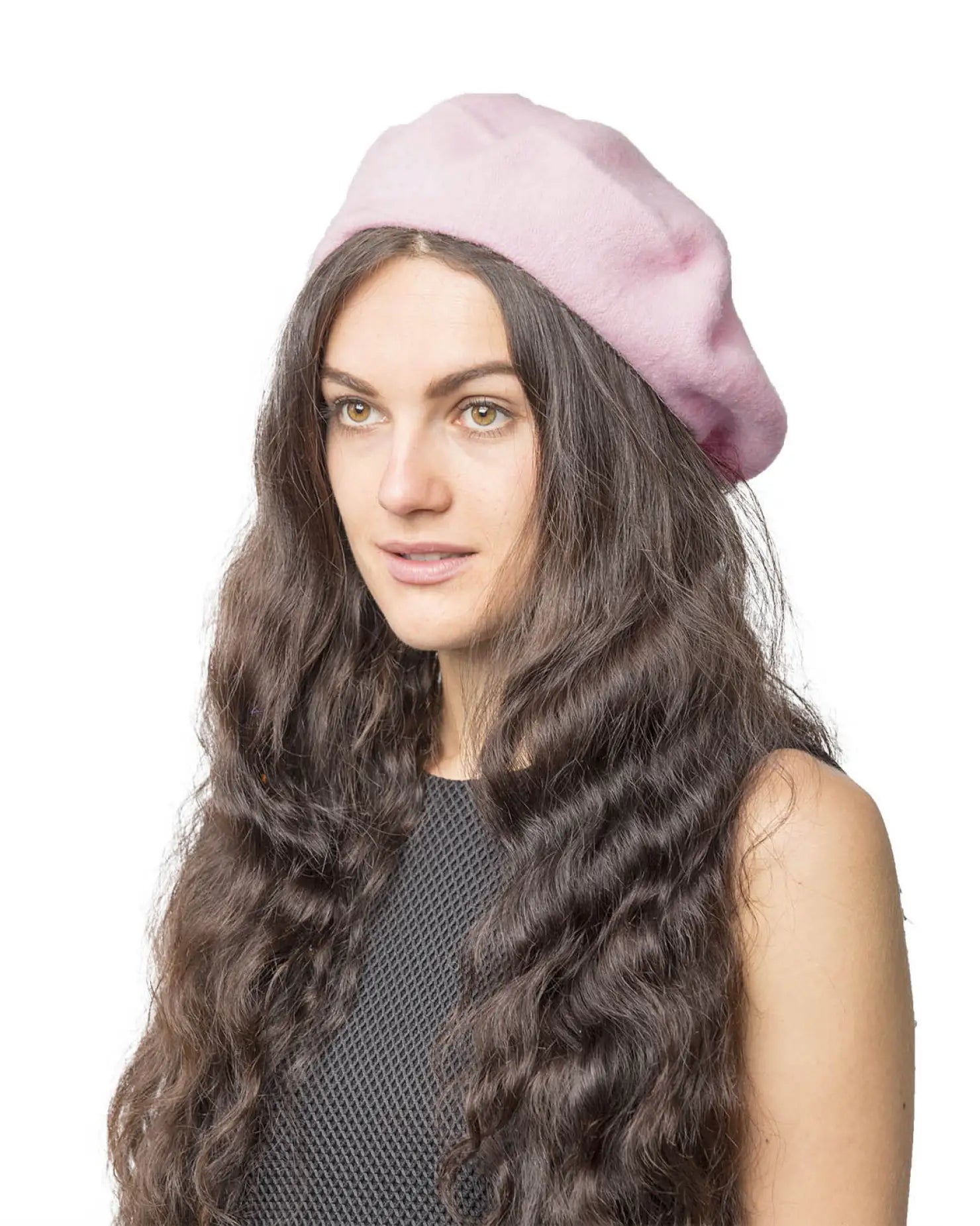 Woman with long hair wearing pink French wool beret.