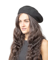 French wool beret styled by woman with long hair and black hat