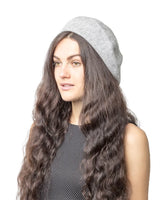 French wool beret in elegant colors on woman with long hair.