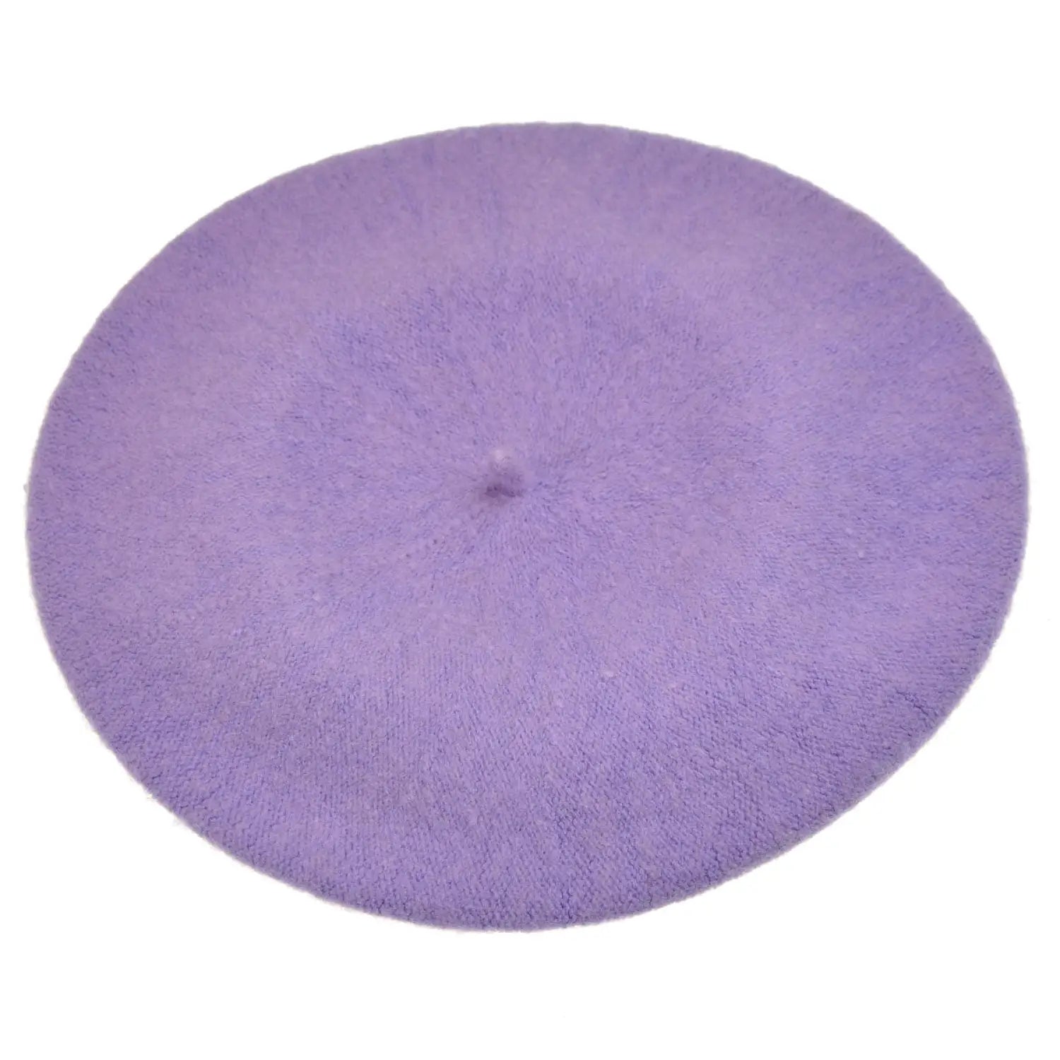French wool beret next to purple round rug