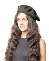Stylish woman wearing green French wool beret