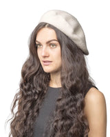 French wool beret enhances long-haired woman’s elegance