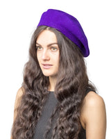 Stylish woman wearing a purple wool beret