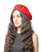 Stylish woman wearing a red French wool beret hat