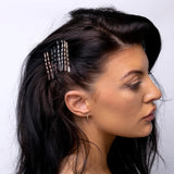 Woman with long black hair wearing gold and silver hair comb - Twisted Kirby Metal Bobby Hair Grips