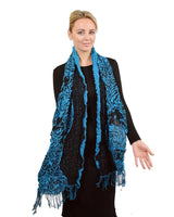 Two tone textured blue scarf worn by a woman