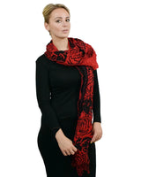 Two Tone Textured Bubble Look Scarf: Woman wearing red and black scarf.