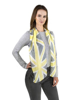 Elegant woman modeling a silk scarf with a subtle grey and yellow Union Jack pattern, versatile and stylish.