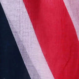 Close-up of a scarf showing a section of the Union Jack design with bold stripes in red, white, and blue.