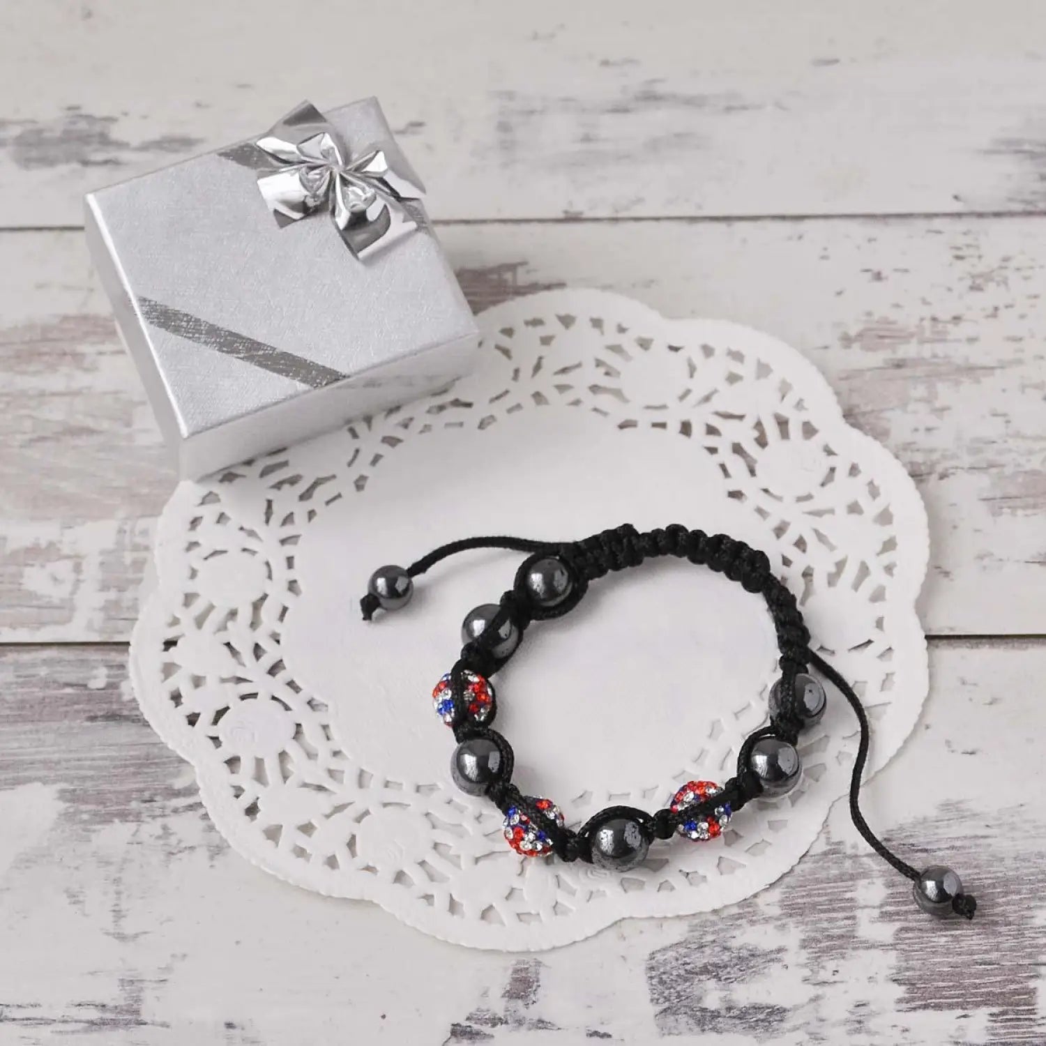 Black bracelet with red, white, and blue beads in Union Jack Shamballa Ring set.