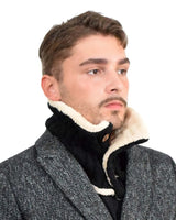 Man wearing black and white jacket with Unisex Sherpa-Lined Chunky Buttoned Snood Scarf.
