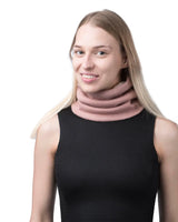 Woman wearing pink turtleneck sweater with unisex sherpa-lined knitted snood