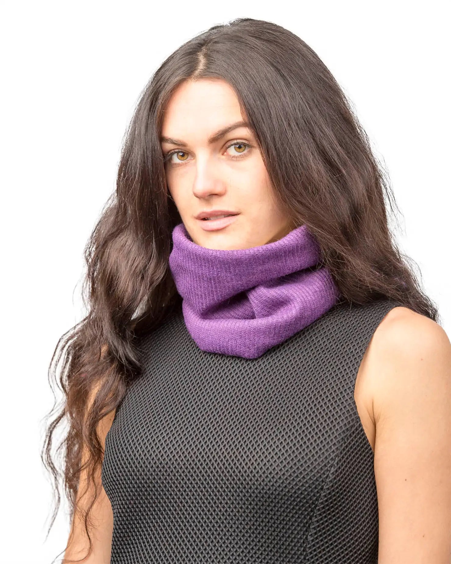 Woman wearing a purple scarf with unisex sherpa-lined knitted snood.