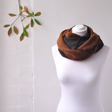 Unisex Winter Snood Scarf with Two-Tone Design next to a Mannequin