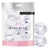 White velvet large scrunchies hair tie packaged in white bag.