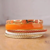 Vibrant Metal Stackable Bangle with orange and gold accents