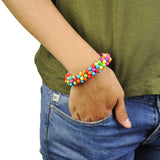 Child wearing vibrant multi-coloured bead bracelet