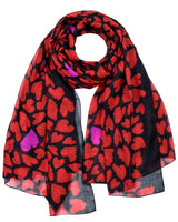 Red and black oversized heart print scarf with flower design.