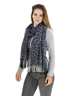 Leopard print pashmina scarf with tassels on woman