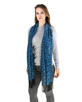 Stylish woman wearing blue leopard print scarf with tassels