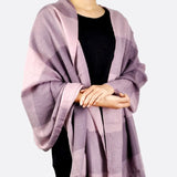 Warm Oversized Checked Blanket Scarf - Woman wearing a purple and black plaid scarf
