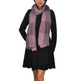 Woman wearing purple scarf in Warm Oversized Checked Blanket Scarf.