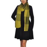Woman wearing black dress and green scarf with Oversized Checked Blanket Scarf