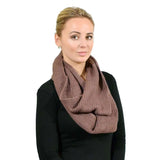 Woman wearing a brown plain knitted snood.