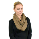 Woman wearing brown knitted snood for winter.