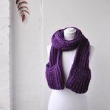 Winter Chunky Knitted Scarf with Pockets displayed on mannequin in front of white brick wall