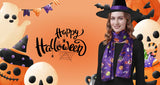 Woman in a witch’s hat and a purple Halloween-themed scarf.