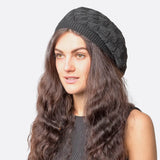 Woman wearing black hat with braid in Women’s Leaf Design Knitted Crochet Beanie Hat.
