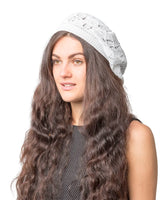 Women’s Leaf Design Knitted Crochet Beanie Hat featuring a woman with long brown hair wearing a white knit hat