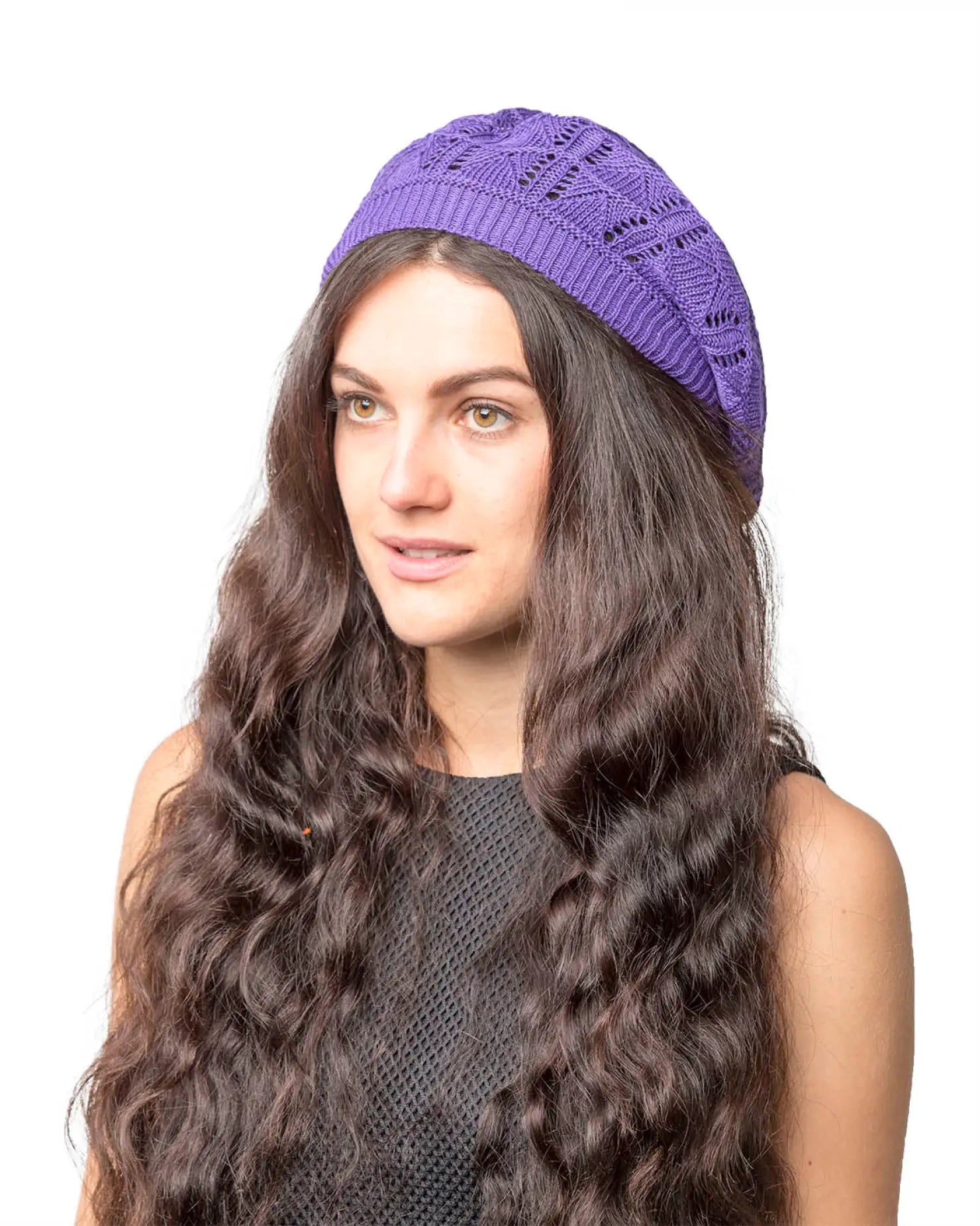 Woman wearing purple hat with black top in Women’s Triangle Design Knitted Crochet Beanie Hat.