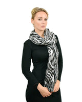 Zebra print metallic tasselled scarf on woman.