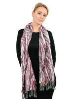 Zebra print metallic tasselled scarf worn by woman